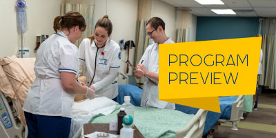 Students practice on mannequins in the nursing lab.