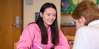 student working at a table