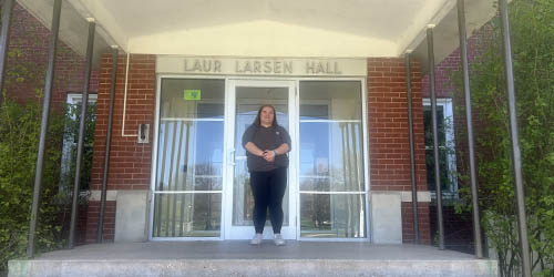 Molly Sahm stands outside Larsen Hall