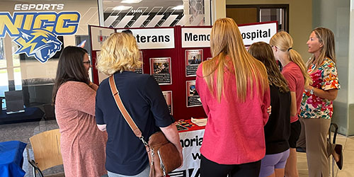 Community members and students visit a booth at the NICC Career Fair.