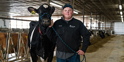 Student with a cow