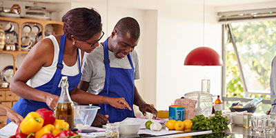 A young couple cooking together