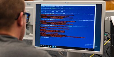 Male student works on a computer