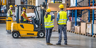 Warehouse employees wearing safety gear