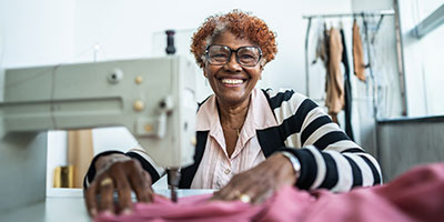 Person sitting at a sewing machine