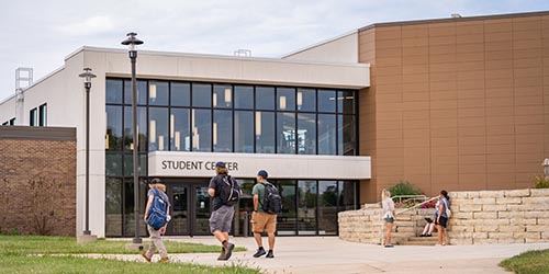 Students walk outside on Calmar campus
