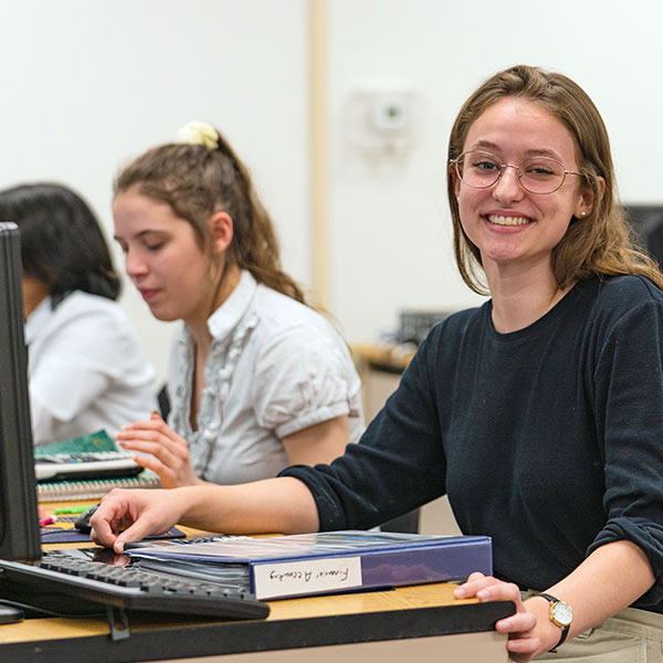 female students work at computers