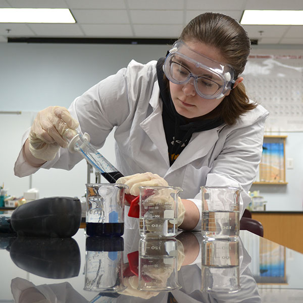 Female student working in a science lab