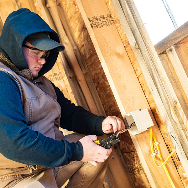 NICC student installing an outlet