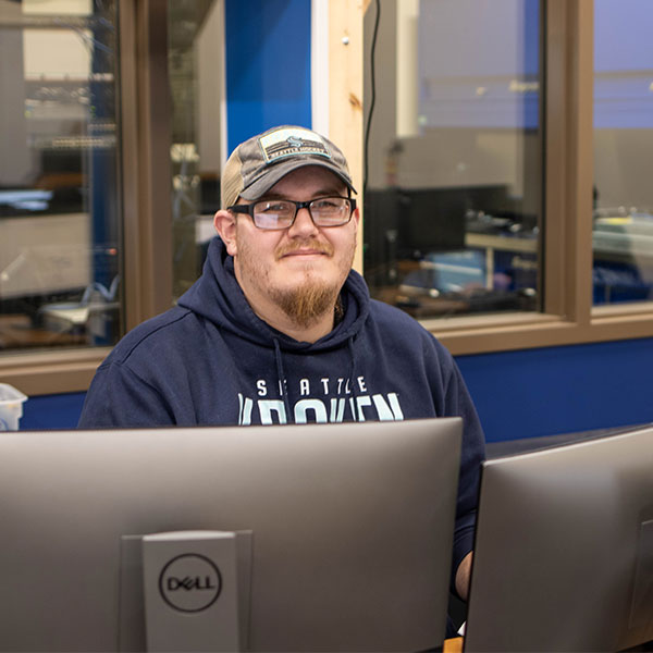 Male student works at a computer