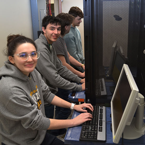 Students work at a control panel