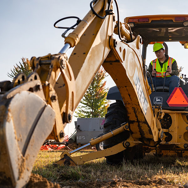 NICC Student operating a backhoe