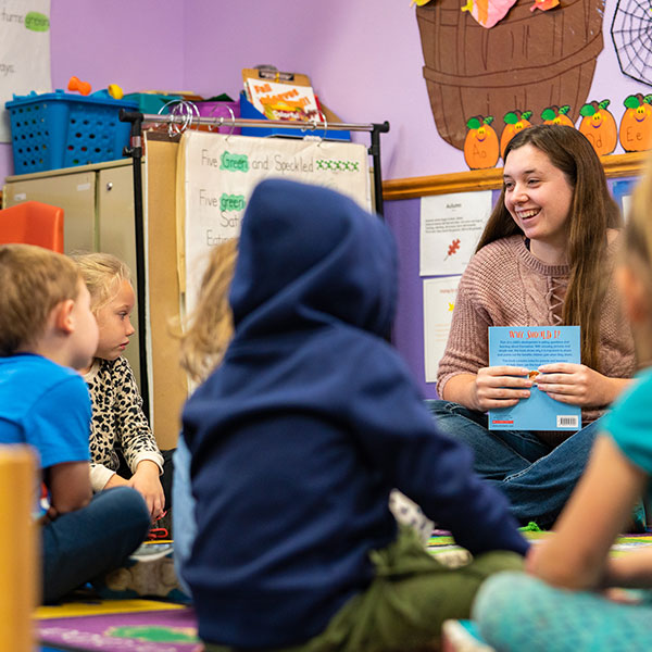 Teacher reads to young children