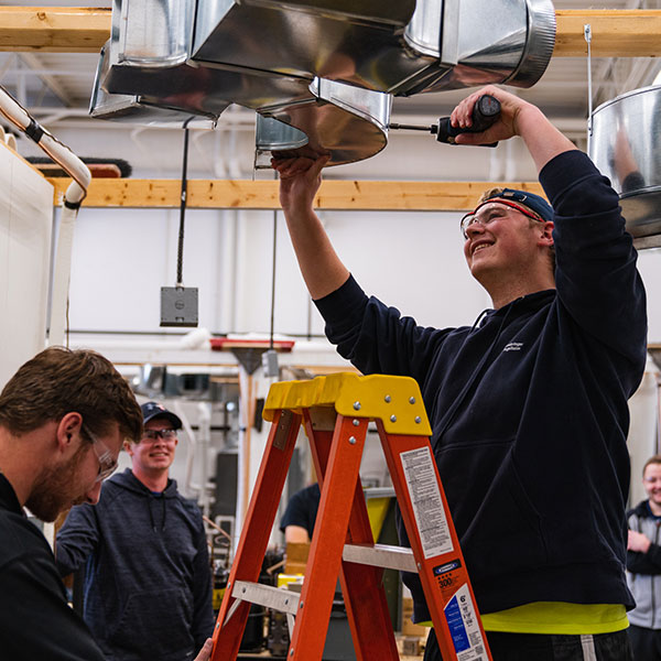 HVAC student working on a system in class