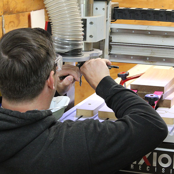 Student working with a router