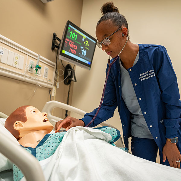 Nursing student working on a dummy