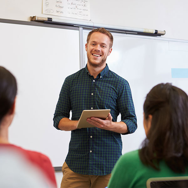 Male high school teacher in class