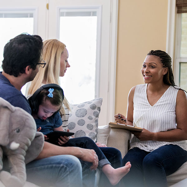 Female counselor working with a family