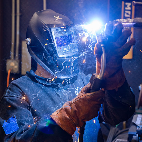 Welder wearing a mask